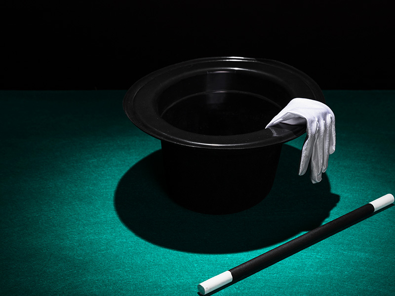 aplique-luz-sobre-el-sombrero-de-copa-con-guantes-blancos-y-varita